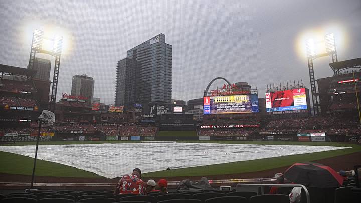 Jul 27, 2024; St. Louis, Missouri, USA; The tarp covers the field during a rain delay ahead of a game between the St. Louis Cardinals and the Washington Nationals at Busch Stadium. Mandatory Credit: Jeff Le-Imagn Images