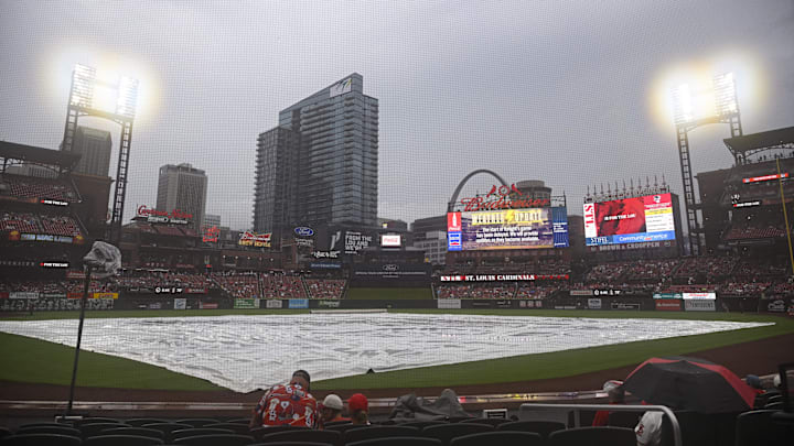 Jul 27, 2024; St. Louis, Missouri, USA; The tarp covers the field during a rain delay ahead of a game between the St. Louis Cardinals and the Washington Nationals at Busch Stadium. Mandatory Credit: Jeff Le-Imagn Images