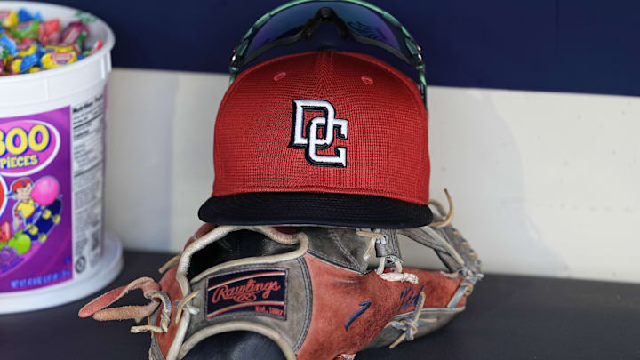 Jul 12, 2024; Milwaukee, Wisconsin, USA; An Washington Nationals hat and glove sit in the dugout during batting practice prior to the game against the Milwaukee Brewers at American Family Field. Mandatory Credit: Jeff Hanisch-Imagn Images Jul 12, 2024; Milwaukee, Wisconsin, USA; An Washington Nationals hat and glove sit in the dugout during batting practice prior to the game against the Milwaukee Brewers at American Family Field. Mandatory Credit: Jeff Hanisch-Imagn Images