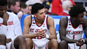 Mar 22, 2025; Providence, RI, USA; St. John's Red Storm guard RJ Luis Jr. (12), guard Kadary Richmond (1) and teammates on the bench during the second half of a second round men’s NCAA Tournament game against the Arkansas Razorbacks at Amica Mutual Pavilion. Mandatory Credit: Brian Fluharty-Imagn Images