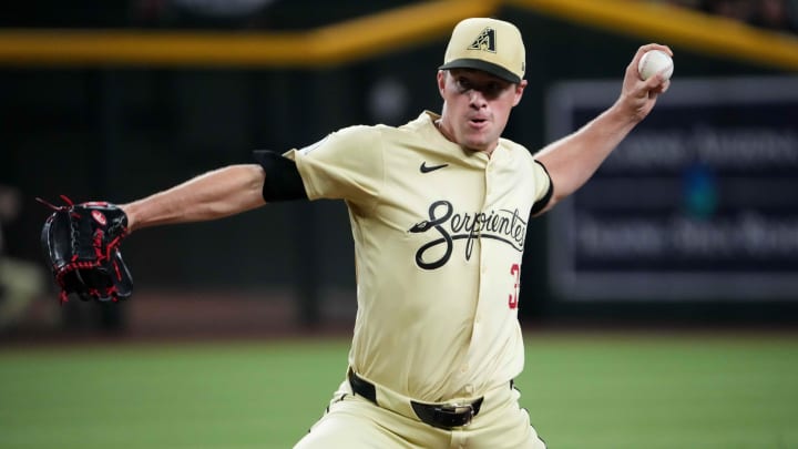 Aug 13, 2024; Phoenix, Arizona, USA; Arizona Diamondbacks pitcher Joe Mantiply (35) pitches against the Colorado Rockies during the ninth inning at Chase Field. Mandatory Credit: Joe Camporeale-USA TODAY Sports