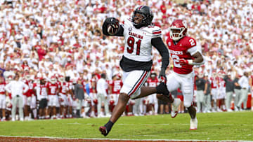 Oct 19, 2024; Norman, Oklahoma, USA;  South Carolina Gamecocks defensive tackle Tonka Hemingway (91) returns a fumble for a touchdown during the first half against the Oklahoma Sooners at Gaylord Family-Oklahoma Memorial Stadium. Mandatory Credit: Kevin Jairaj-Imagn Images