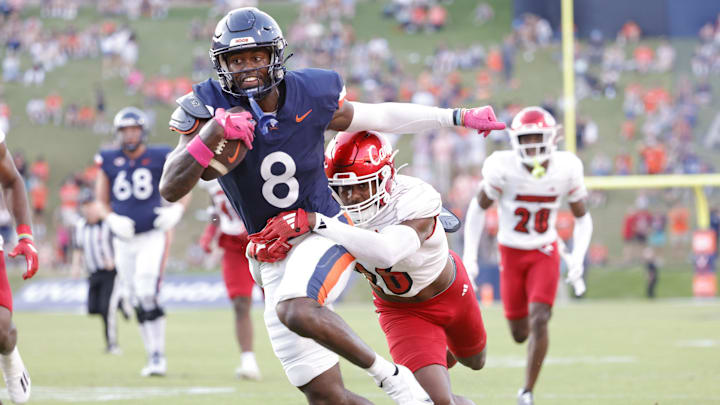 Virginia Cavaliers wide receiver Malachi Fields (8) carries the ball as Louisville Cardinals defensive back M.J. Griffin (26)