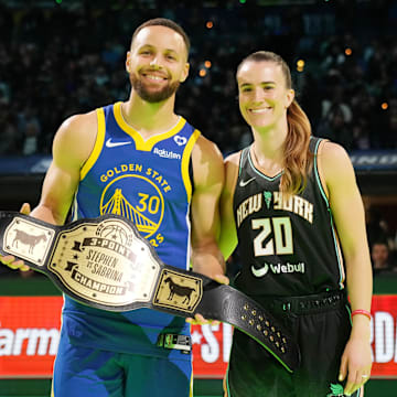 Feb 17, 2024; Indianapolis, IN, USA; Golden State Warriors guard Stephen Curry (30) and New York Liberty guard Sabrina Ionescu (20) after the Stephen vs Sebrina three-point challenge during NBA All Star Saturday Night at Lucas Oil Stadium. Mandatory Credit: Kyle Terada-Imagn Images