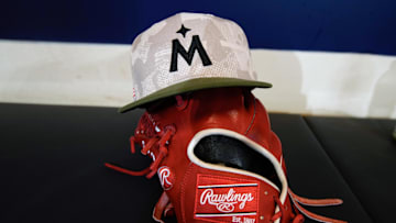 May 16, 2025; Milwaukee, Wisconsin, USA;  General view of a Minnesota Twins military-inspired baseball cap in the dugout prior to the game against the Milwaukee Brewers at American Family Field. Mandatory Credit: Jeff Hanisch-Imagn Images