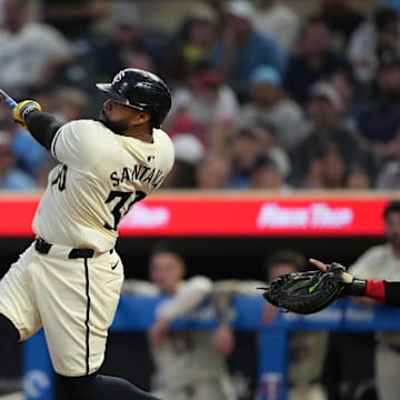 Minnesota Twins first baseman Carlos Santana (30) hits a single during the second inning against the Los Angeles Angels at Target Field in Minneapolis on Sept. 10, 2024. 