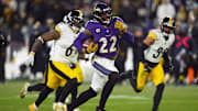 Jan 11, 2025; Baltimore, Maryland, USA; Baltimore Ravens running back Derrick Henry (22) runs to score a touchdown against the Pittsburgh Steelers in the third quarter in an AFC wild card game at M&T Bank Stadium. Mandatory Credit: Mitch Stringer-Imagn Images