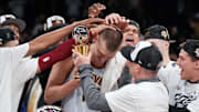 May 22, 2023; Los Angeles, California, USA; Denver Nuggets center Nikola Jokic (15) and head coach Michael Malone celebrate beating the Los Angeles Lakers in game four of the Western Conference Finals for the 2023 NBA playoffs at Crypto.com Arena. Mandatory Credit: Kirby Lee-Imagn Images