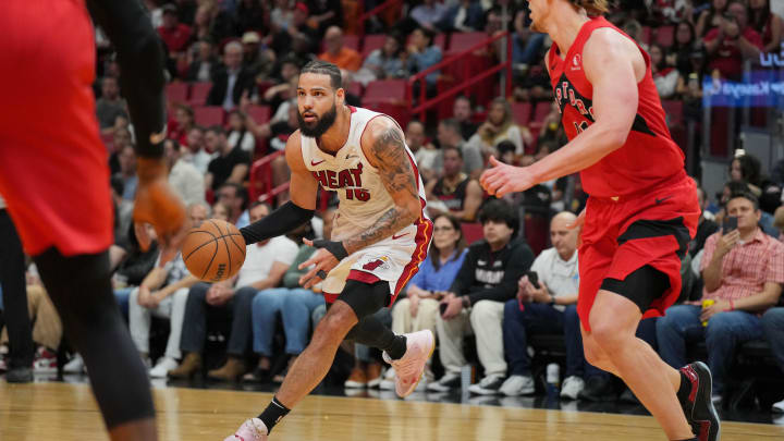 Apr 12, 2024; Miami, Florida, USA;  Miami Heat forward Caleb Martin (16) drives the ball toward the basket against the Toronto Raptors during the first half at Kaseya Center. Mandatory Credit: Jim Rassol-USA TODAY Sports