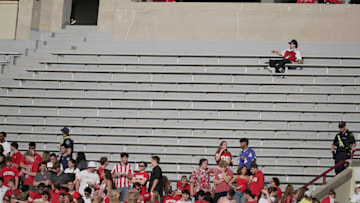 A man has a large seating area to himself during the second quarter of the Wisconsin - Ohio State football game Saturday, October 18, 2025 at Camp Randall Stadium in Madison, Wisconsin.