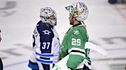 May 17, 2025; Dallas, Texas, USA; Winnipeg Jets goaltender Connor Hellebuyck (37) shakes hands with Dallas Stars goaltender Jake Oettinger (29) after the Stars defeat the Jets in the overtime period in game six of the second round of the 2025 Stanley Cup Playoffs at American Airlines Center. Mandatory Credit: Jerome Miron-Imagn Images