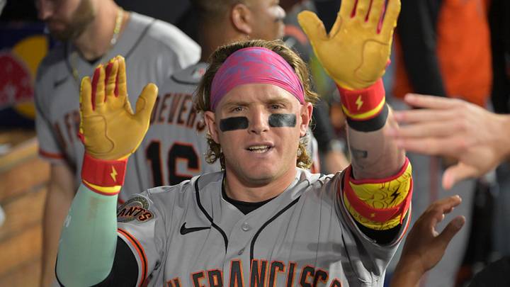 Los Angeles, California, USA; San Francisco Giants center fielder Harrison Bader (9) shakes hands with teammates in the dugout after hitting a one run home run against the Los Angeles Dodgers during the fifth inning at Dodger Stadium. Mandatory Credit: Jayne Kamin-Oncea-Imagn Images