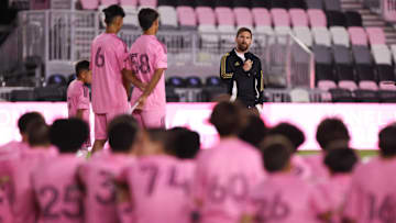 Dec 4, 2024; Ft. Lauderdale, Florida, USA; Inter Miami CF forward Lionel Messi (10) talks to Inter Miami CF academy players during the presentation of the Landon Donovan MVP award at Chase Stadium. Mandatory Credit: Sam Navarro-Imagn Images