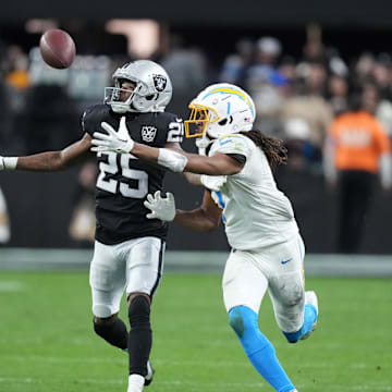 Jan 5, 2025; Paradise, Nevada, USA; Los Angeles Chargers wide receiver Quentin Johnston (1) catches the ball against Las Vegas Raiders cornerback Decamerion Richardson (25) at Allegiant 