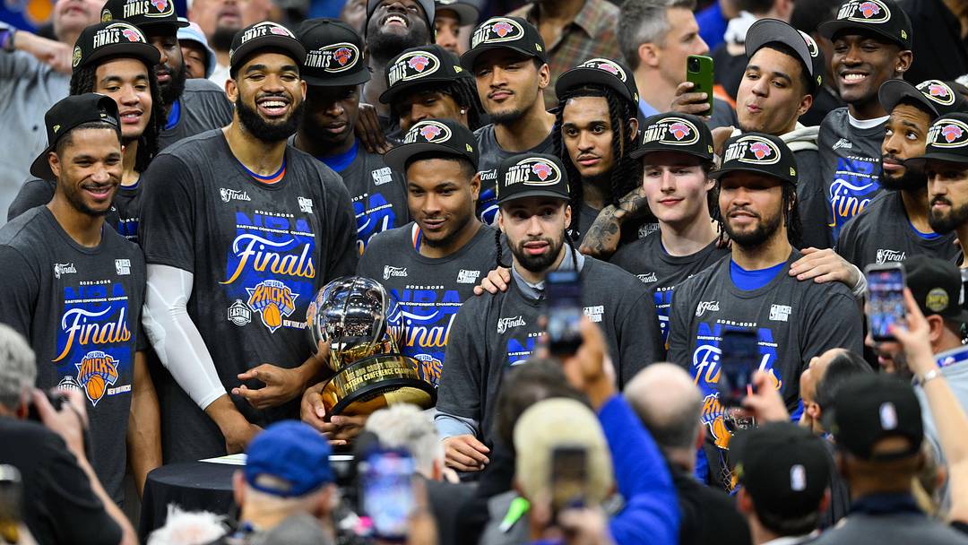May 25, 2026; Cleveland, Ohio, USA; New York Knicks pose with the 2026 Eastern Conference trophy after defeating the Cleveland Cavaliers in game four 