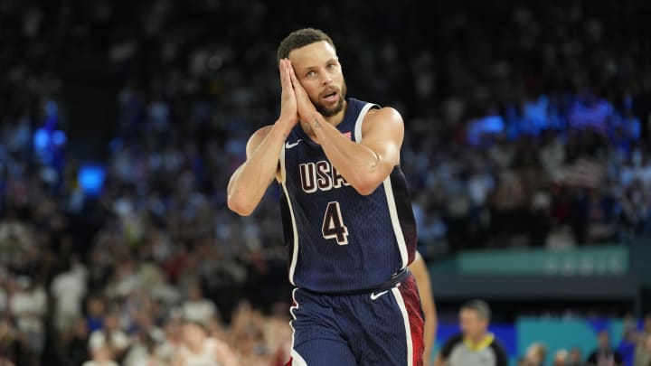 Aug 10, 2024; Paris, France; United States guard Stephen Curry (4) reacts in the second half against France in the men's basketball gold medal game during the Paris 2024 Olympic Summer Games at Accor Arena. 