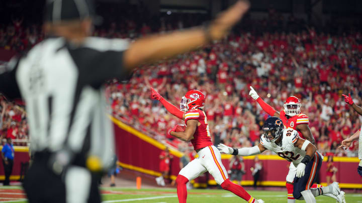 Aug 22, 2024; Kansas City, Missouri, USA; Kansas City Chiefs safety Jaden Hicks (21) recovers a fumble against Chicago Bears defensive end Daniel Hardy (92) during the first half at GEHA Field at Arrowhead Stadium. Mandatory Credit: Jay Biggerstaff-USA TODAY Sports