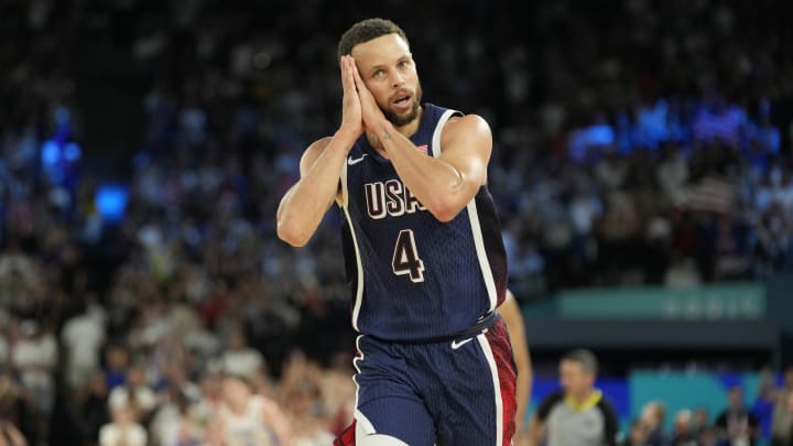 Aug 10, 2024; Paris, France; United States shooting guard Stephen Curry (4) reacts in the second half against France in the men's basketball gold medal game during the Paris 2024 Olympic Summer Games at Accor Arena. 