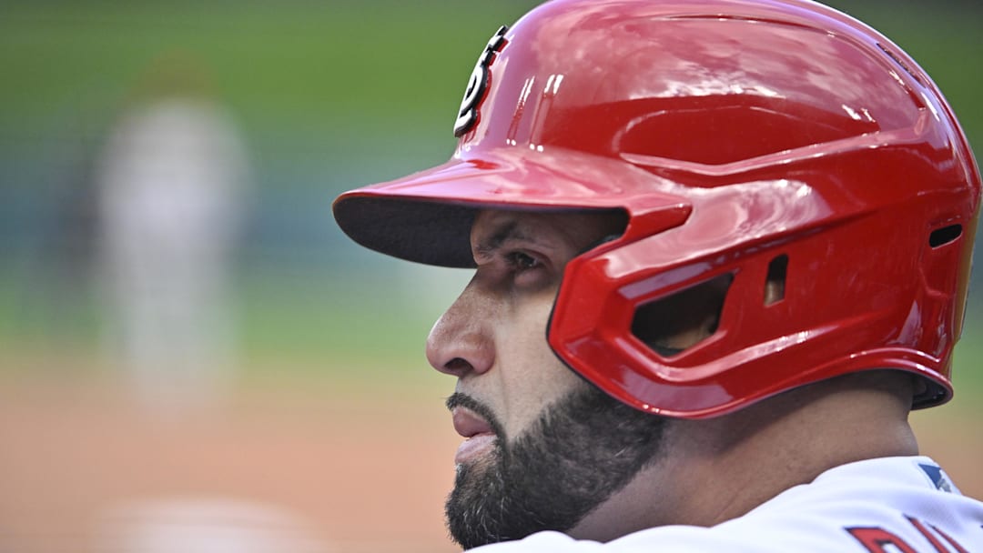 Oct 7, 2022; St. Louis, Missouri, USA; St. Louis Cardinals designated hitter Albert Pujols (5) looks on from the dugout during the sixth inning against the Philadelphia Phillies in game one of the Wild Card series for the 2022 MLB Playoffs at Busch Stadium. Mandatory Credit: Jeff Curry-Imagn Images
