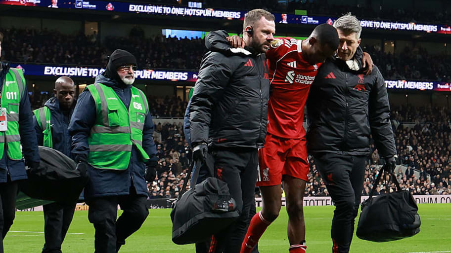 Alexander Isak helped off pitch by Lverpool staff.