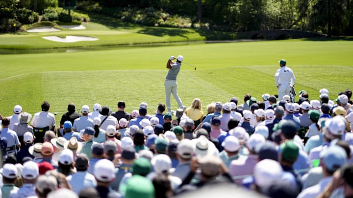 Brooks Koepka tees off on Hole 12 at The Masters tournament