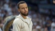 Golden State Warriors guard Stephen Curry looks on against the Minnesota Timberwolves.