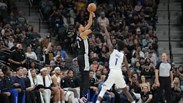 Jan 31, 2024; San Antonio, Texas, USA;  San Antonio Spurs center Victor Wembanyama (1) shoots over Orlando Magic forward Jonathan Isaac (1) in the second half at Frost Bank Center. Mandatory Credit: Daniel Dunn-Imagn Images