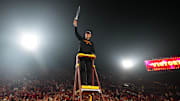 Nov 29, 2025; Los Angeles, California, USA; Southern California Trojans head coach Lincoln Riley leads the Spirit of Troy marching band in a rendition of Tribute to Troy after teh game against the UCLA Bruins at United Airlines Field at Los Angeles Memorial Coliseum. Mandatory Credit: Kirby Lee-Imagn Images