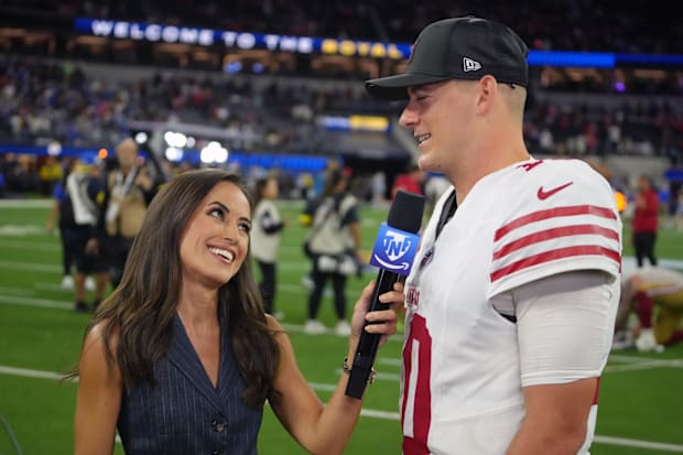 Prime Thursday Night Football sideline reporter Kaylee Hartung (left) interviews San Francisco 49ers quarterback Mac Jones.
