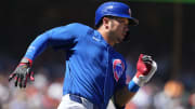 Jun 27, 2024; San Francisco, California, USA; Chicago Cubs left fielder Seiya Suzuki (27) runs to first base after hitting a double against the San Francisco Giants during the eighth inning at Oracle Park.