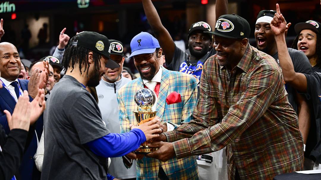 May 25, 2026; Cleveland, Ohio, USA; Patrick Ewing and Walt Frazier present New York Knicks guard Jalen Brunson (11), left, with the 2026 Eastern Conference MVP trophy