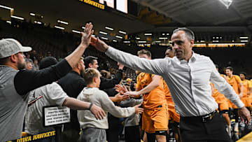 Nov 18, 2025; Iowa City, Iowa, USA; Iowa Hawkeyes head coach Ben McCollum greets fans after the game against the Southeast Missouri State Redhawks at Carver-Hawkeye Arena. Mandatory Credit: Jeffrey Becker-Imagn Images