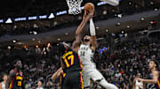 Mar 30, 2025; Milwaukee, Wisconsin, USA;  Milwaukee Bucks forward Giannis Antetokounmpo (34) shoots against Atlanta Hawks center Onyeka Okongwu (17) during the first quarter at Fiserv Forum. Mandatory Credit: Jeff Hanisch-Imagn Images