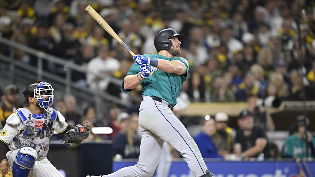 Apr 15, 2026; San Diego, California, USA; Seattle Mariners right fielder Luke Raley  hits a two-run home run during the fifth inning against the San Diego Padres at Petco Park. All MLB players are wearing number 42 today to honor Jackie Robinson. Mandatory Credit: Denis Poroy-Imagn Images
