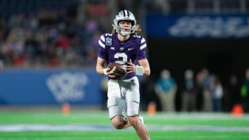 Dec 28, 2023; Orlando, FL, USA; Kansas State quarterback Avery Johnson (2) runs the ball against NC State in the second quarter at Camping World Stadium. Mandatory Credit: Jeremy Reper-USA TODAY Sports