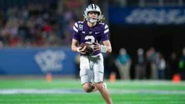 Dec 28, 2023; Orlando, FL, USA; Kansas State quarterback Avery Johnson (2) runs the ball against NC State in the second quarter at Camping World Stadium. Mandatory Credit: Jeremy Reper-USA TODAY Sports