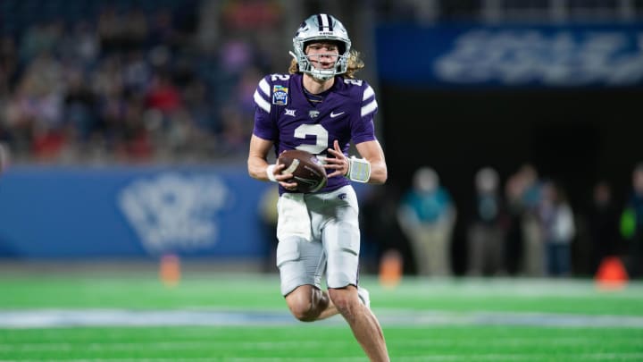 Dec 28, 2023; Orlando, FL, USA; Kansas State quarterback Avery Johnson (2) runs the ball against NC State in the second quarter at Camping World Stadium. Mandatory Credit: Jeremy Reper-USA TODAY Sports