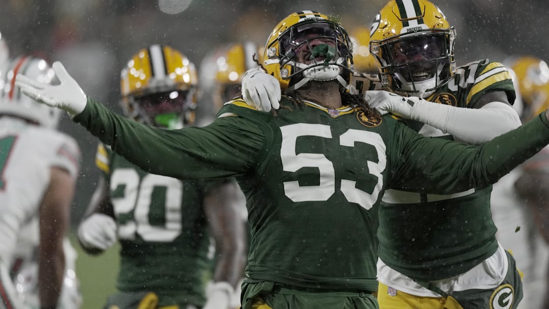 Nov 28, 2024; Green Bay, Wisconsin, USA;  Green Bay Packers defensive end Arron Mosby (53) celebrates his sack of Miami Dolphins quarterback Tua Tagovailoa (not pictured) at Lambeau Field. Mandatory Credit: Mark Hoffman-Imagn Images