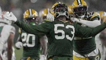 Nov 28, 2024; Green Bay, Wisconsin, USA;  Green Bay Packers defensive end Arron Mosby (53) celebrates his sack of Miami Dolphins quarterback Tua Tagovailoa (not pictured) at Lambeau Field. Mandatory Credit: Mark Hoffman-Imagn Images