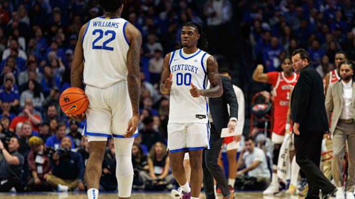 Nov 26, 2024; Lexington, Kentucky, USA; Kentucky Wildcats guard Otega Oweh (00) reacts after center Amari Williams (22) is called for a foul during the first half against the Western Kentucky Hilltoppers at Rupp Arena at Central Bank Center. Mandatory Credit: Jordan Prather-Imagn Images