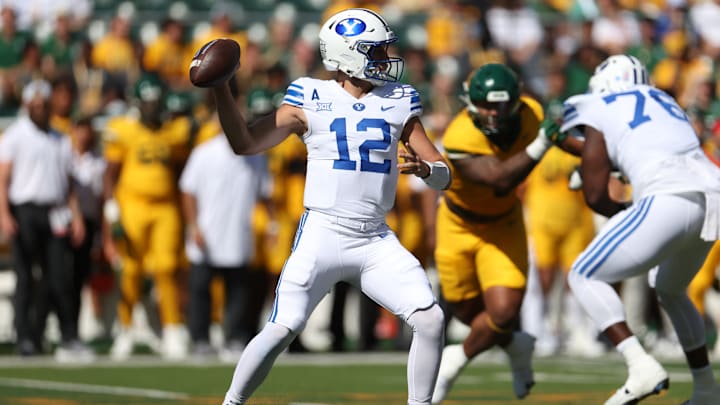 Jake Retzlaff steps up to deliver a pass against Baylor.