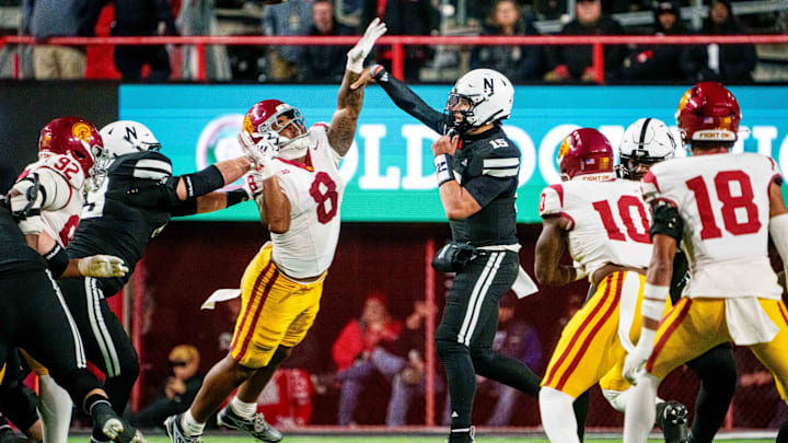 Nov 1, 2025; Lincoln, Nebraska, USA; Nebraska Cornhuskers quarterback Dylan Raiola (15) passes against Southern California Trojans defensive tackle Devan Thompkins (8) during the second quarter at Memorial Stadium. Nov 1, 2025; Lincoln, Nebraska, USA; Nebraska Cornhuskers quarterback Dylan Raiola (15) passes against Southern California Trojans defensive tackle Devan Thompkins (8) during the second quarter at Memorial Stadium.