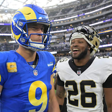Nov 2, 2025; Inglewood, California, USA; Los Angeles Rams quarterback Matthew Stafford (9) and New Orleans Saints safety Terrell Burgess (26) talk following a game at SoFi Stadium. Mandatory Credit: Jayne Kamin-Oncea-Imagn Images