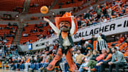 Jan 23, 2024; Stillwater, Oklahoma, USA; Oklahoma State Cowboys mascot Pistol Pete takes a shot before the game against the TCU Horned Frogs at Gallagher-Iba Arena. Mandatory Credit: William Purnell-Imagn Images