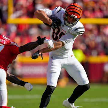 Cincinnati Bengals tight end Mike Gesicki (88) breaks a tackle attempt from Kansas City Chiefs safety Chamarri Conner (27) on a catch in the second quarter of the NFL Week 2 game between the Kansas City Chiefs and the Cincinnati Bengals at Arrowhead Stadium in Kansas City on Sunday, Sept. 15, 2024.