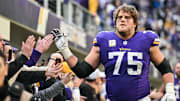 Dec 1, 2024; Minneapolis, Minnesota, USA; Minnesota Vikings offensive tackle Brian O'Neill (75) reacts with the crowd after the game against the Arizona Cardinals at U.S. Bank Stadium.