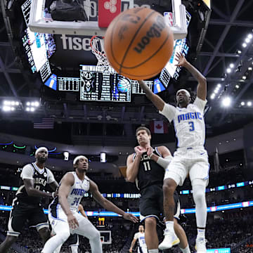 Jan 15, 2025; Milwaukee, Wisconsin, USA;  Orlando Magic guard Kentavious Caldwell-Pope (3) loses the ball during the second quarter against the Milwaukee Bucks at Fiserv Forum. Mandatory Credit: Jeff Hanisch-Imagn Images