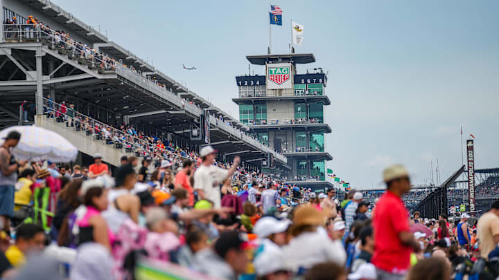 Racing fans pack the viewing mounds during the Indianapolis 500 at Indianapolis Motor Speedway. Racing fans pack the viewing mounds during the Indianapolis 500 at Indianapolis Motor Speedway.