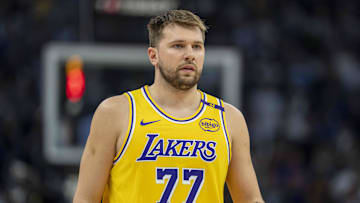 Apr 25, 2025; Minneapolis, Minnesota, USA; Los Angeles Lakers guard Luka Doncic (77) looks on against the Minnesota Timberwolves in the first half during game three of first round for the 2024 NBA Playoffs at Target Center. Mandatory Credit: Jesse Johnson-Imagn Images