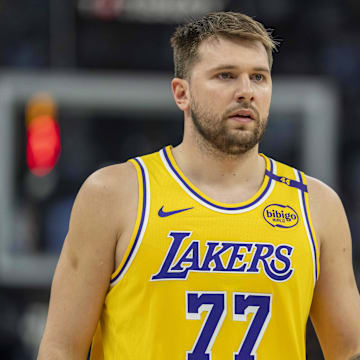 Apr 25, 2025; Minneapolis, Minnesota, USA; Los Angeles Lakers guard Luka Doncic (77) looks on against the Minnesota Timberwolves in the first half during game three of first round for the 2024 NBA Playoffs at Target Center. Mandatory Credit: Jesse Johnson-Imagn Images